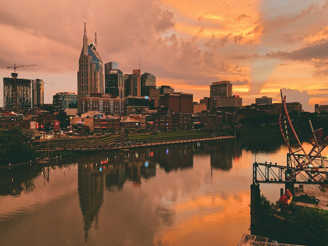 Nashville skyline beneath an orange evening sky