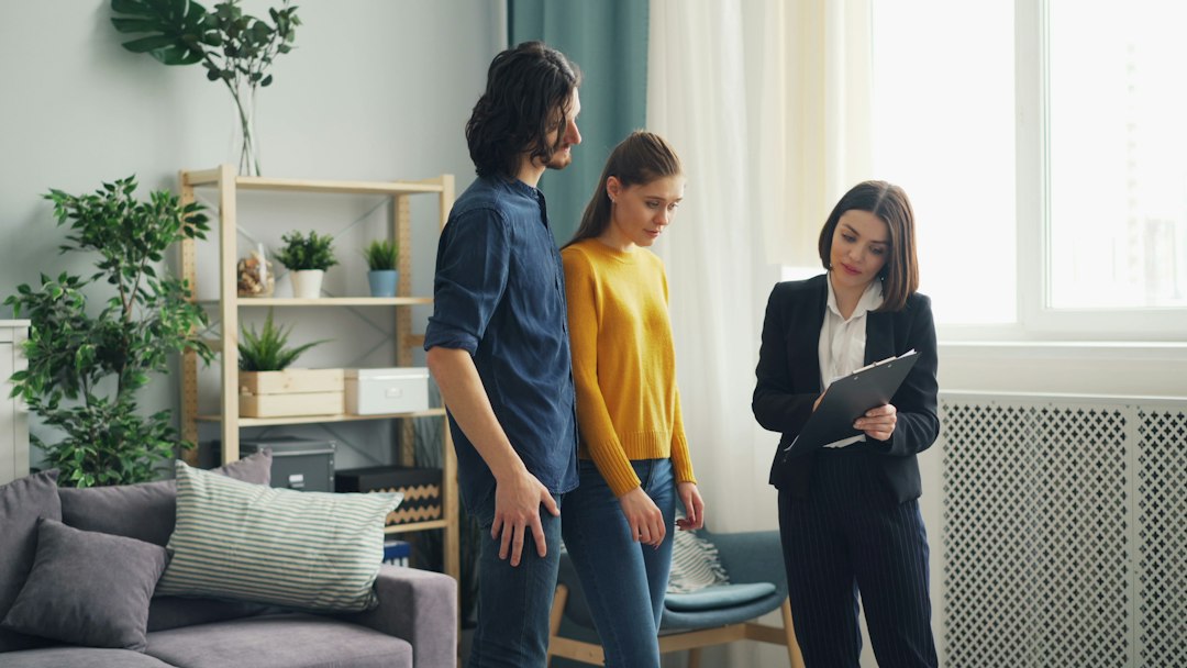 Two people standing in a living room
