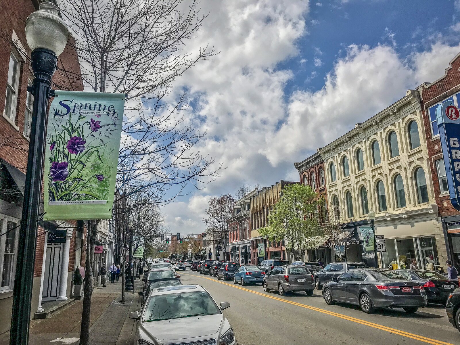 Historic storefronts and traffic along Main Street in downtown Franklin, Tennessee