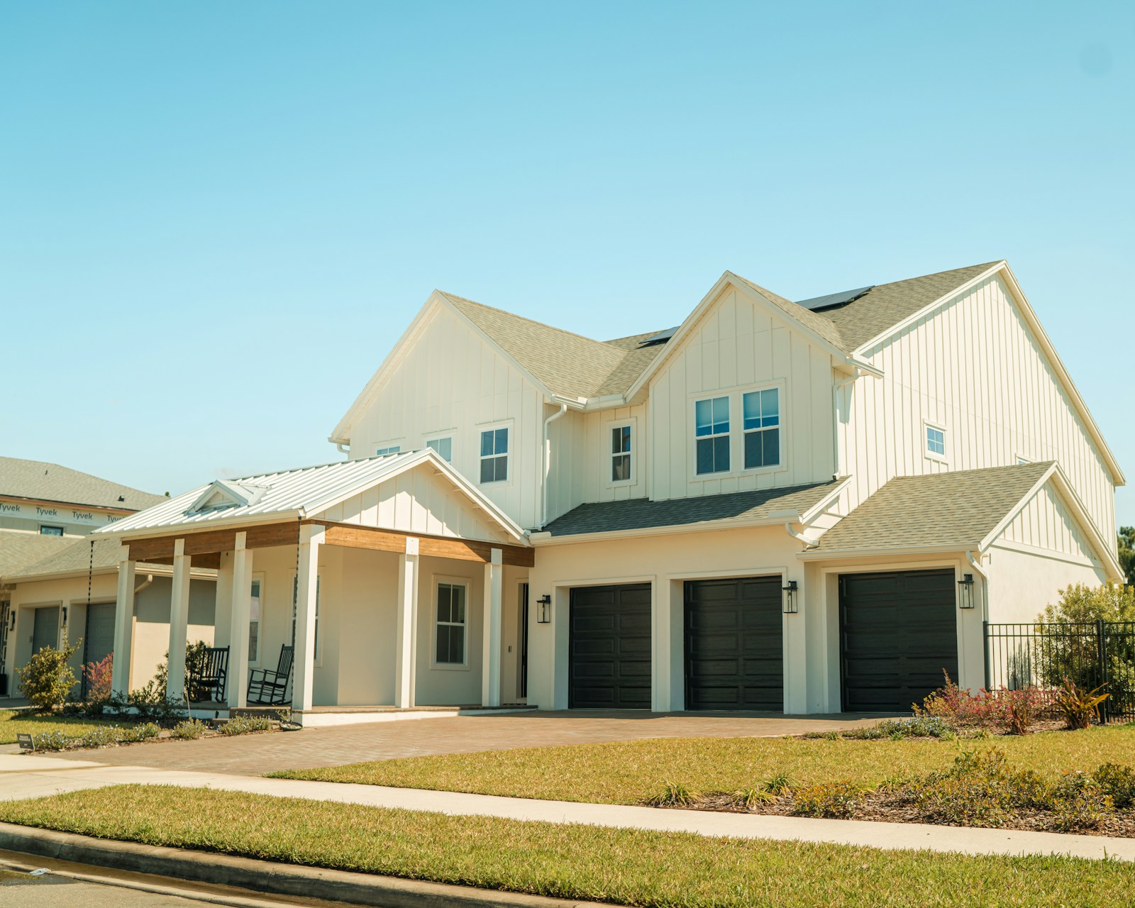 White house with two front garage doors