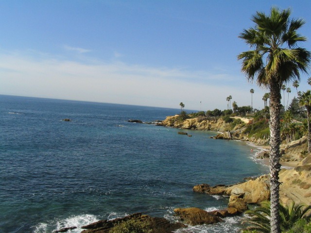 Rocky shoreline and blue water at Laguna Beach in Orange County, California
