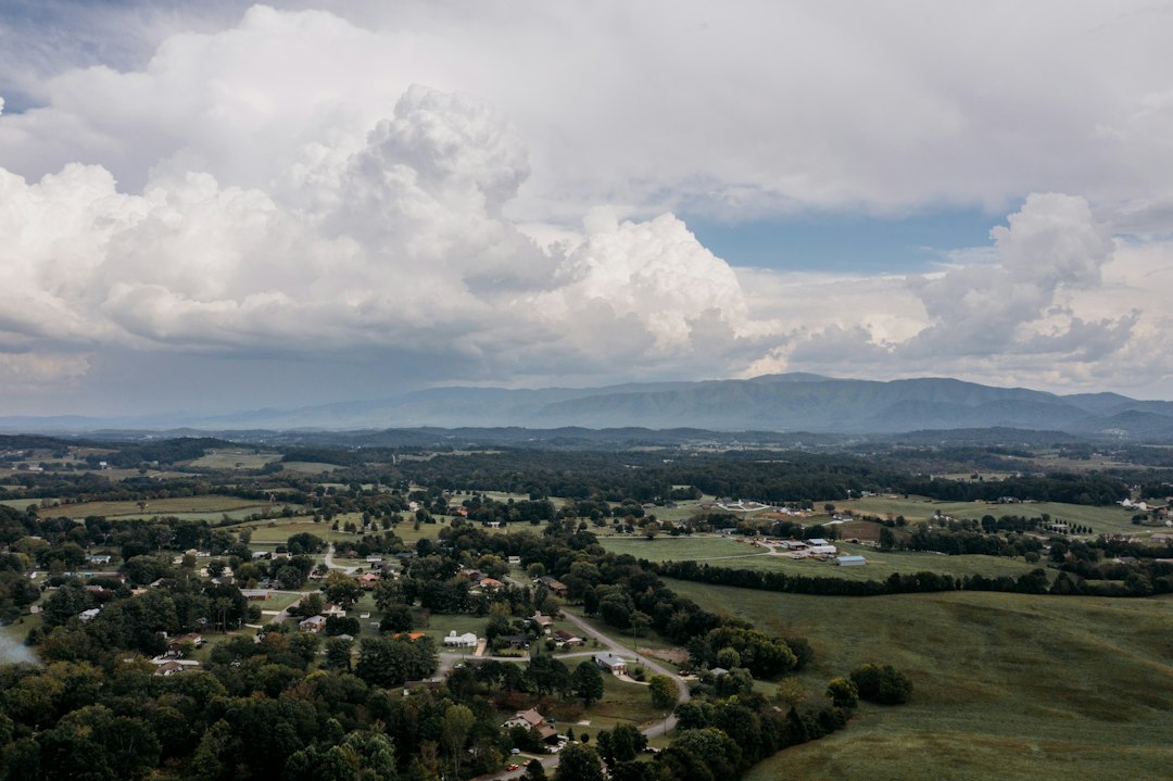Aerial view of a Tennessee town with hills in the distance