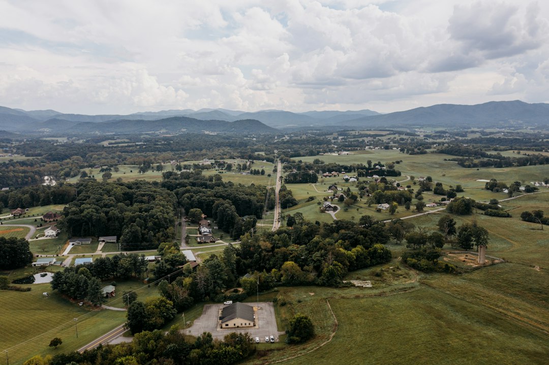 Rural homes, fields and local roads viewed from above; illustrative stock photograph